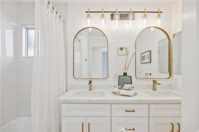 bathroom featuring shower / bath combo and vanity