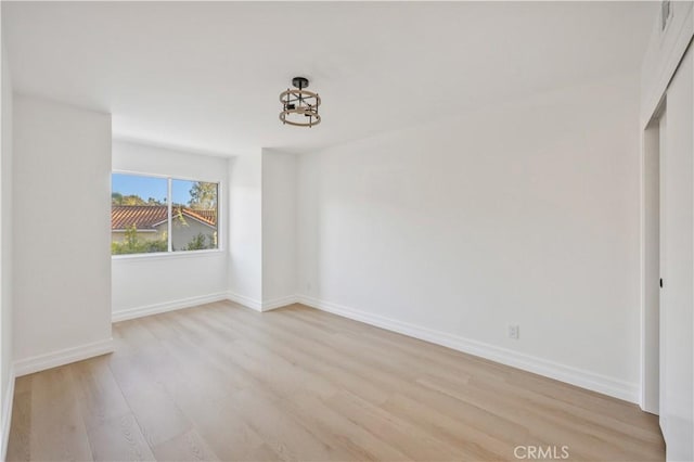 unfurnished room featuring light hardwood / wood-style flooring