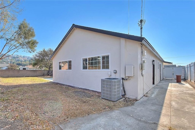 view of home's exterior with central AC unit