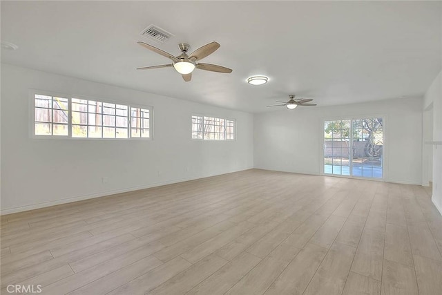 unfurnished room featuring ceiling fan and light hardwood / wood-style flooring