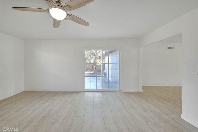 unfurnished room featuring ceiling fan and light hardwood / wood-style flooring