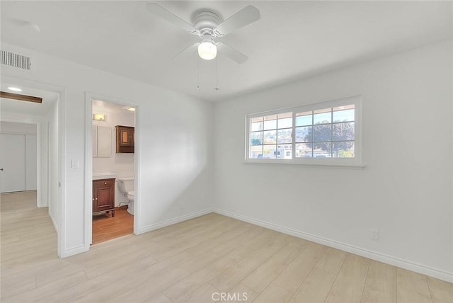 unfurnished room featuring ceiling fan and light hardwood / wood-style flooring