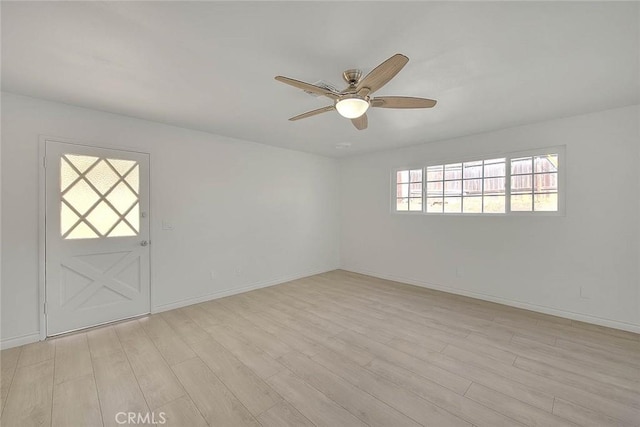 spare room with ceiling fan and light hardwood / wood-style floors