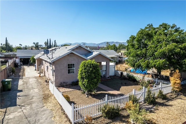 view of side of property with a mountain view