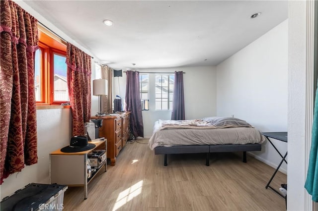 bedroom with light wood-type flooring