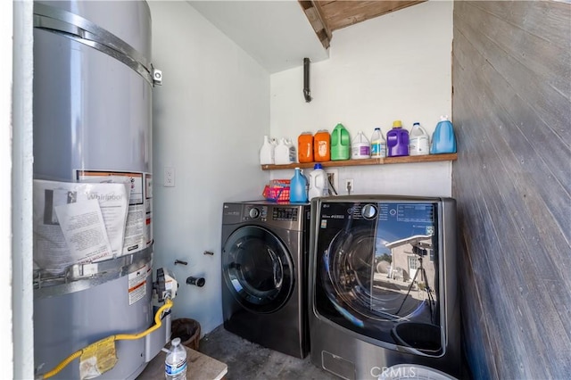 laundry room featuring independent washer and dryer and strapped water heater