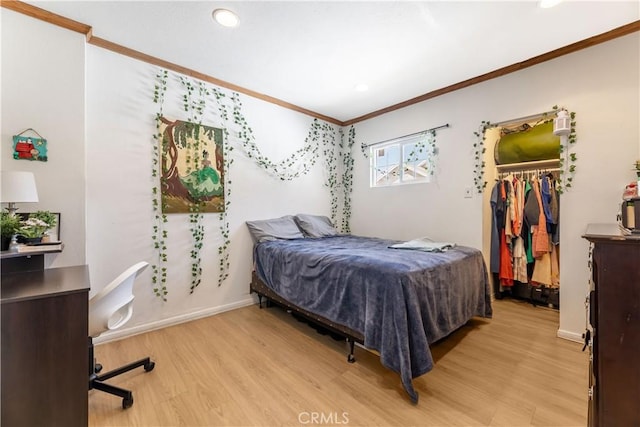 bedroom featuring light wood-type flooring and ornamental molding