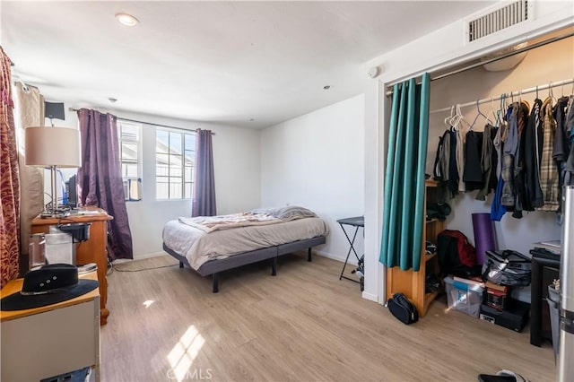 bedroom featuring light wood-type flooring