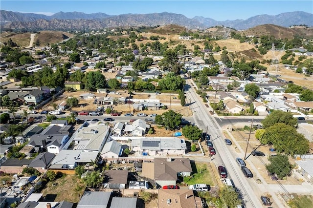 birds eye view of property featuring a mountain view