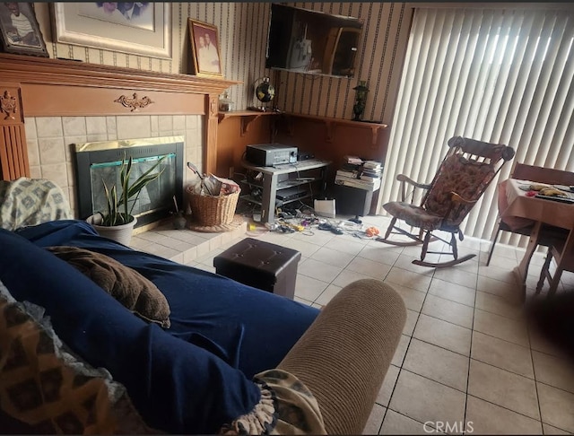 tiled living room with a tiled fireplace