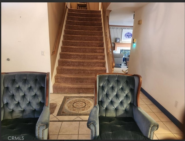 stairs with tile patterned floors