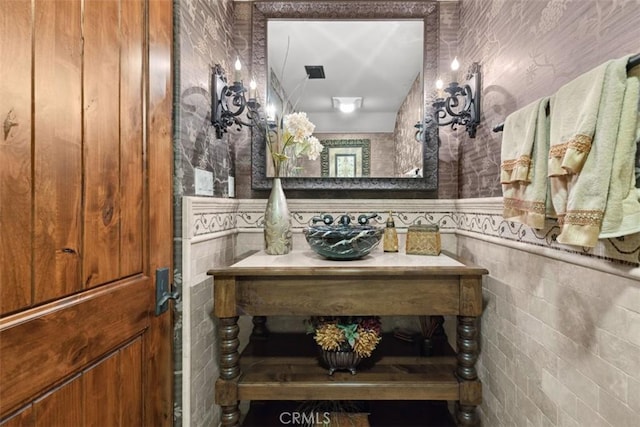 bathroom featuring tile walls and vanity