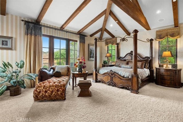 bedroom with carpet floors, multiple windows, and vaulted ceiling with beams