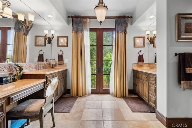 bathroom with french doors and vanity