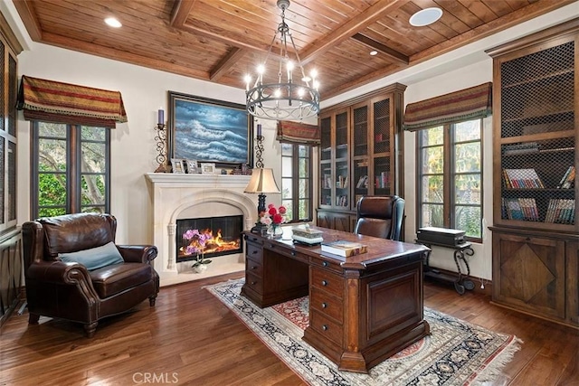 office area with dark wood-type flooring, wooden ceiling, beam ceiling, and an inviting chandelier