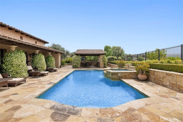 view of swimming pool featuring a gazebo, a patio area, and an in ground hot tub