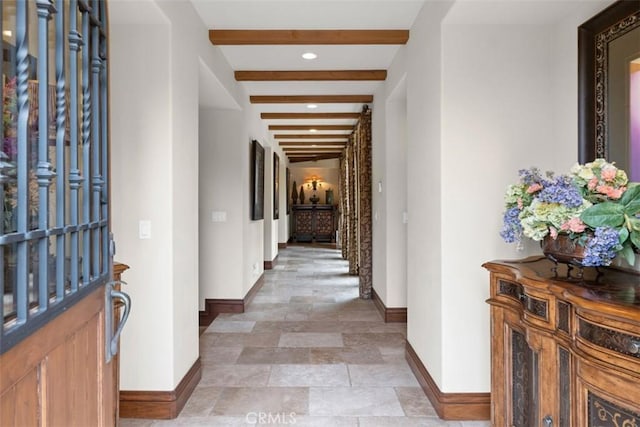 hallway featuring beamed ceiling