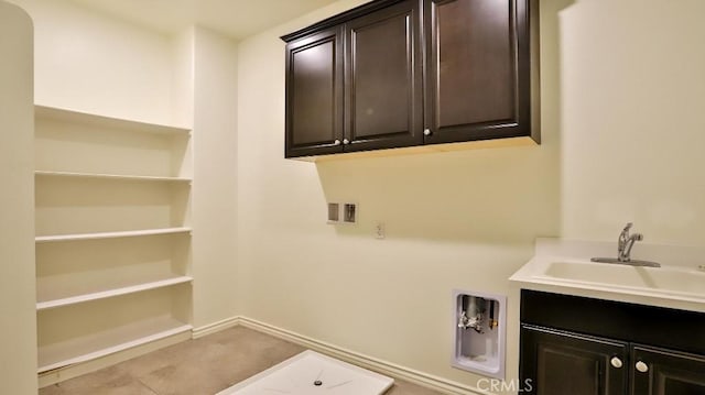 laundry area featuring cabinets, hookup for a washing machine, and sink