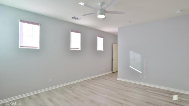 empty room featuring ceiling fan and light hardwood / wood-style floors