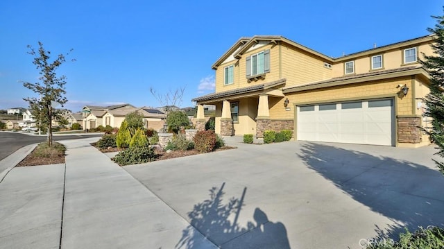 craftsman-style home with a garage