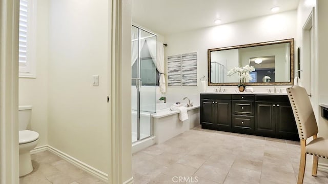 full bathroom featuring toilet, vanity, separate shower and tub, and tile patterned flooring