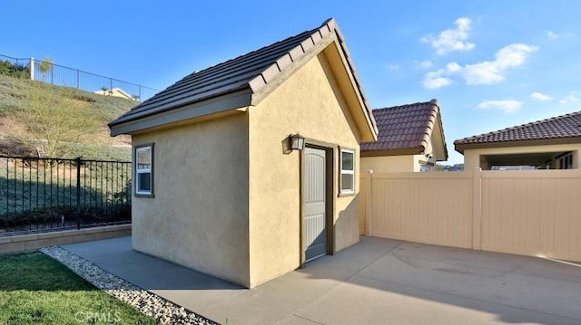 view of side of home featuring a patio area