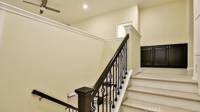 stairway with ceiling fan