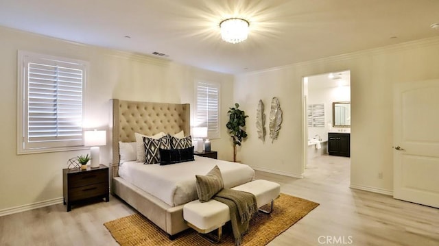 bedroom featuring crown molding, connected bathroom, and hardwood / wood-style floors