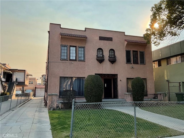 view of front of house with a yard