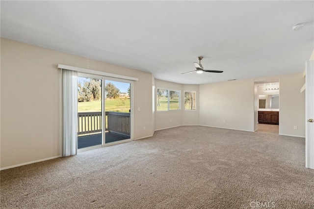 empty room with ceiling fan and light colored carpet