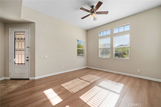 unfurnished room with ceiling fan and light hardwood / wood-style floors