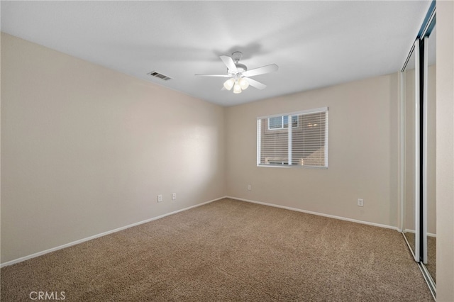 unfurnished bedroom featuring carpet and ceiling fan