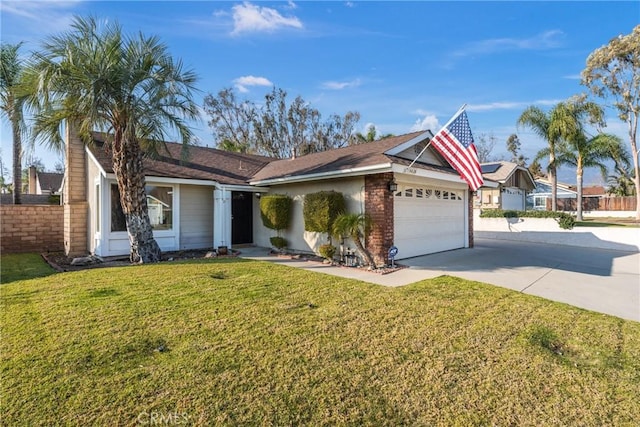 ranch-style home featuring a front yard and a garage