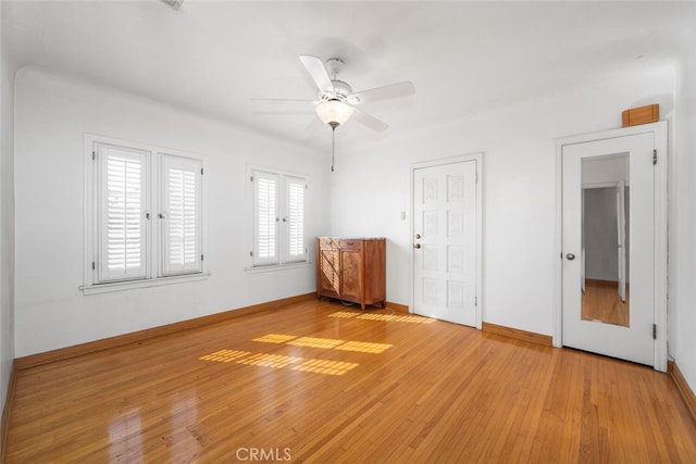 unfurnished bedroom with light hardwood / wood-style flooring and ceiling fan