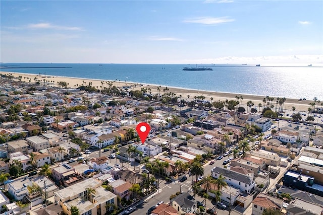 aerial view with a water view and a view of the beach