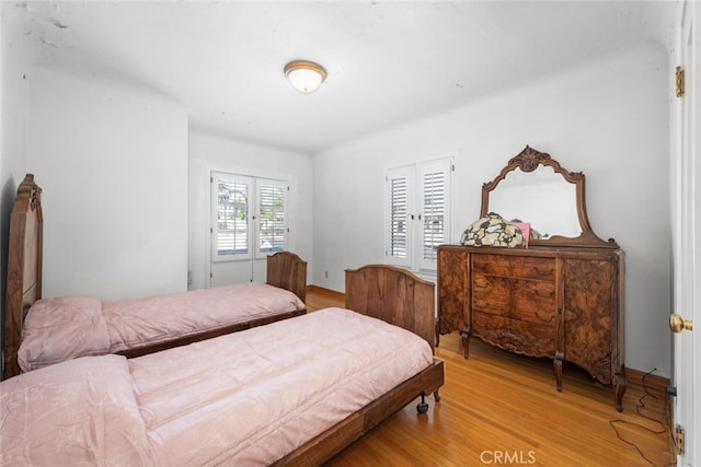 bedroom with light wood-type flooring