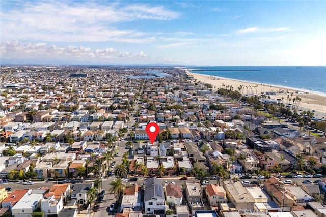 aerial view with a water view and a view of the beach