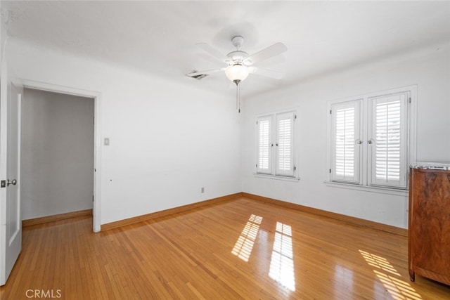 unfurnished room with ceiling fan and light hardwood / wood-style flooring