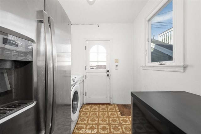 washroom featuring independent washer and dryer