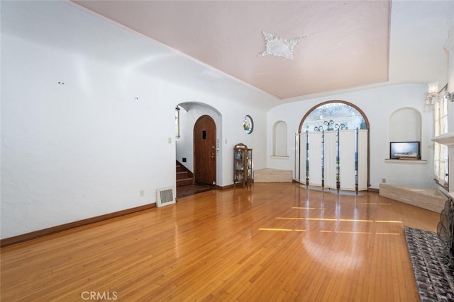 unfurnished room with wood-type flooring