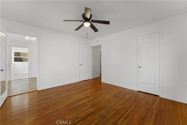 unfurnished room with ceiling fan and hardwood / wood-style floors