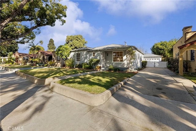 view of front of property with a front lawn and a garage