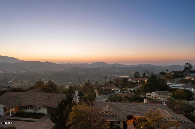 property's view of city featuring a mountain view