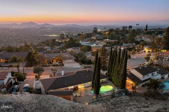 aerial view at dusk with a mountain view