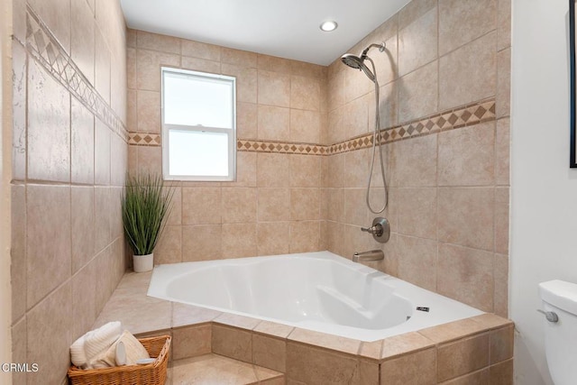 bathroom featuring toilet and separate shower and tub