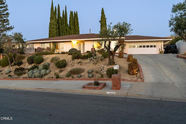 ranch-style home with a garage