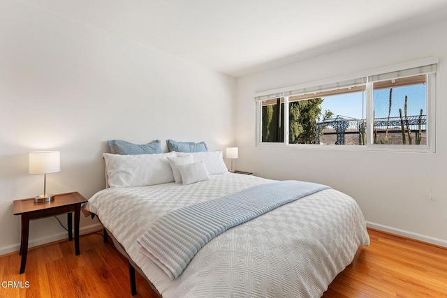 bedroom featuring hardwood / wood-style flooring