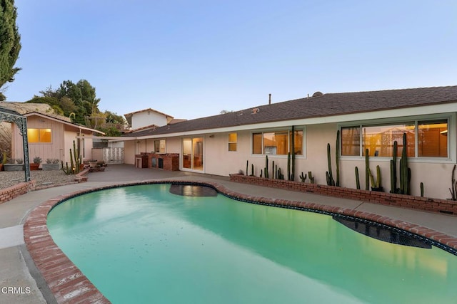 view of pool with a patio area and area for grilling