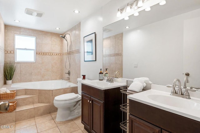 full bathroom with toilet, vanity, tile patterned floors, and tiled shower / bath