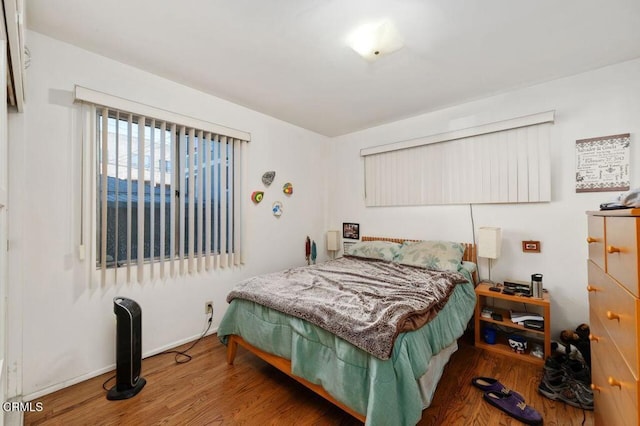 bedroom with wood-type flooring